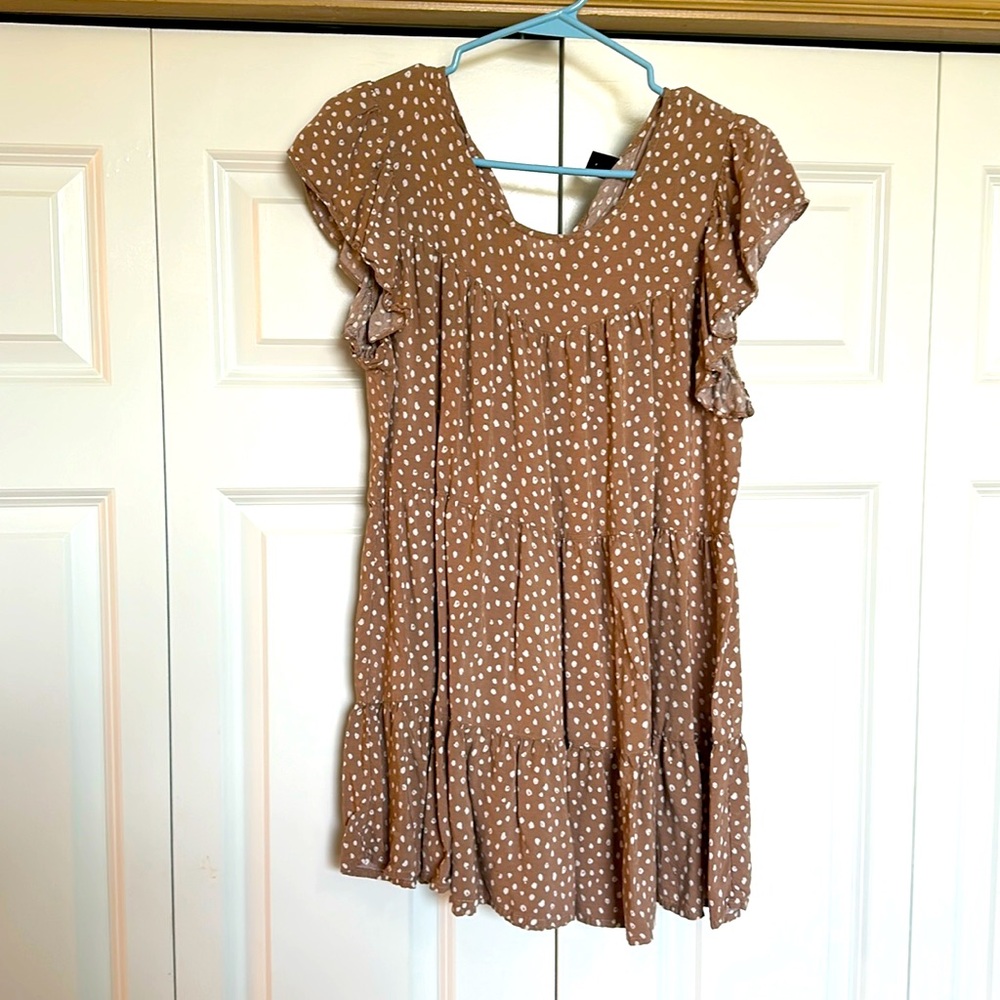 Longer blouse, light brown with white dots.